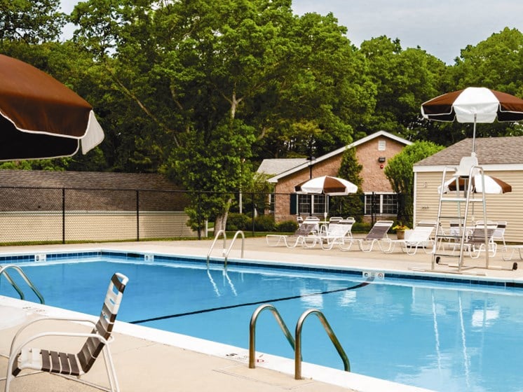 outdoor pool and sundeck with umbrellas at Lakeside Village, New York